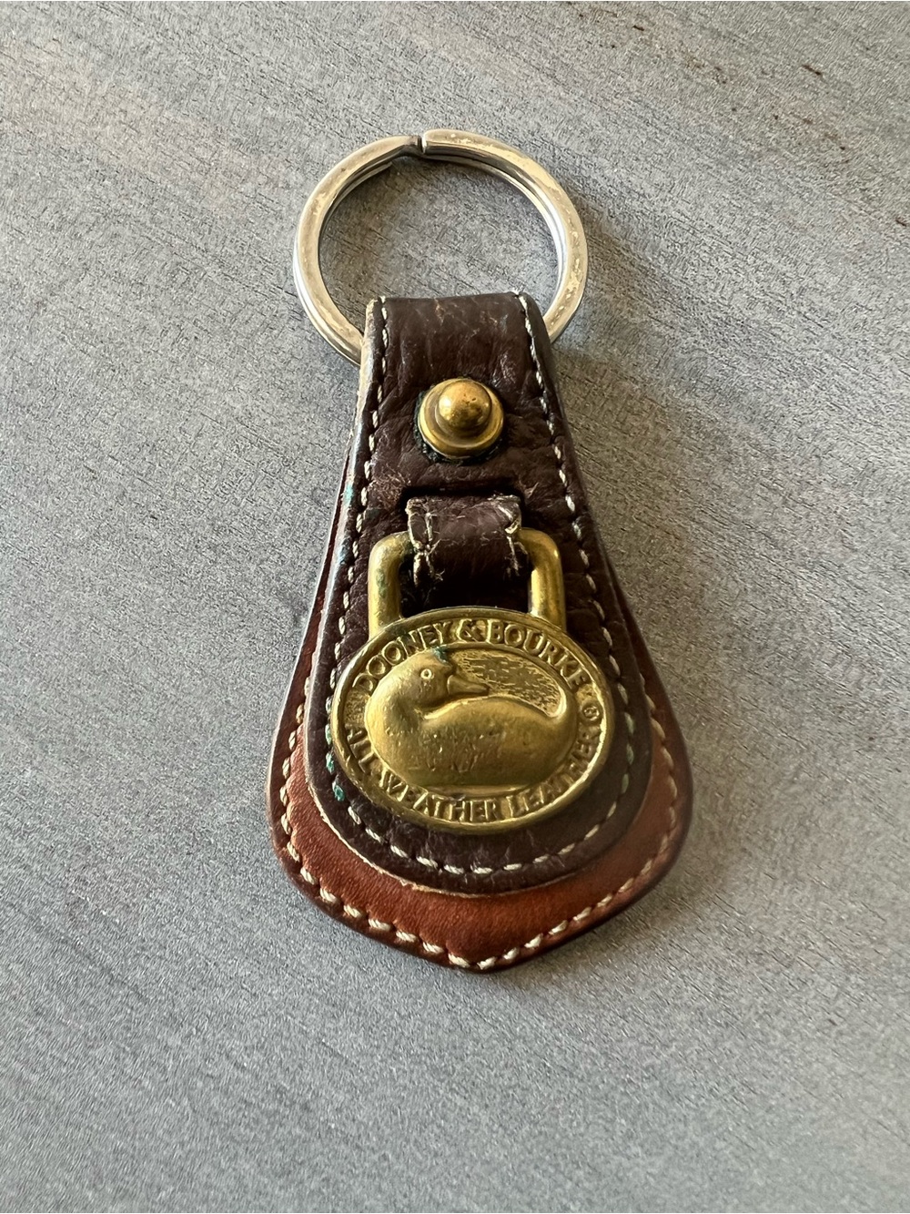Dooney & Bourke Brown Leather Key Fob with Brass Duck Emblem